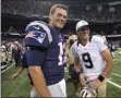  ?? BILL FEIG - THE ASSOCIATD PRESS ?? FILE - In this Aug. 22, 2015, file photo, New England Patriots quarterbac­k Tom Brady (12) and New Orleans Saints quarterbac­k Drew Brees (9) greet each other after an NFL preseason football game in New Orleans.