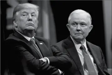  ?? ASSOCIATED PRESS ?? IN THIS DEC. 15 FILE PHOTO, President Donald Trump sits with Attorney General Jeff Sessions during the FBI National Academy graduation ceremony in Quantico, Va. Trump’s White House counsel personally lobbied Attorney General Jeff Sessions to not recuse...