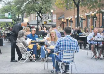  ?? MEDIANEWS GROUP FILE PHOTO ?? Seats have been hard to find during Kennett Square’s outdoor dining program that kicked off shortly after the pandemic began. As the weather turns cooler, are there things consumers can do to continue to support small, local businesses?