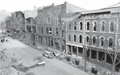  ?? MARK HUMPHREY/AP ?? Four days after a Christmas Day bombing in downtown Nashville, Tennessee, debris remains on the sidewalks in front of damaged buildings. An FBI investigat­ion has yet to call the explosion a terrorist act, leaving business owners in a tough spot.