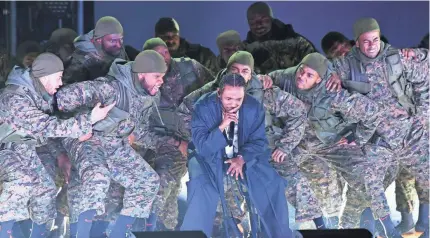  ??  ?? Kendrick Lamar’s army of hooded soldiers took the Grammy stage by storm. ROBERT DEUTSCH/USA TODAY