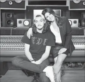  ?? The Associated Press ?? Deacon Frey, son of the late Eagles co-founder Glenn Frey, left, and his mother Cindy Frey pose for a portrait at Dog House Recording Studio in Los Angeles. Deacon Frey is keeping his dad's legacy alive by touring and performing with the Eagles. Cindy...