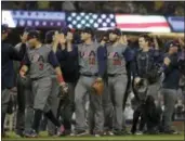  ?? CHRIS CARLSON — THE ASSOCIATED PRESS ?? United States celebrates after defeating Japan, 2-1, in a semifinal in the World Baseball Classic in Los Angeles, Tuesday.