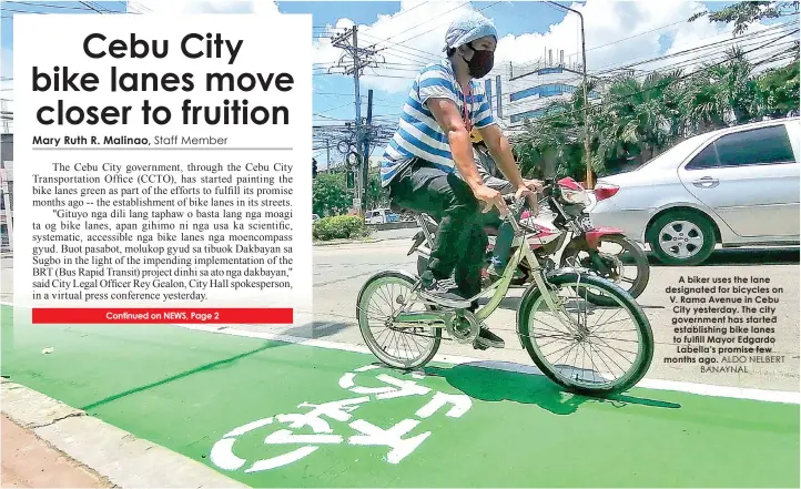  ?? ALDO NELBERT BANAYNAL ?? A biker uses the lane designated for bicycles on V. Rama Avenue in Cebu City yesterday. The city government has started establishi­ng bike lanes to fulfill Mayor Edgardo Labella’s promise few months ago.