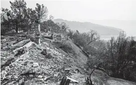  ?? MAX WHITTAKER/THE NEW YORK TIMES ?? The remains of a residence destroyed by a wildfire Aug. 22 in Spanish Flat, California.