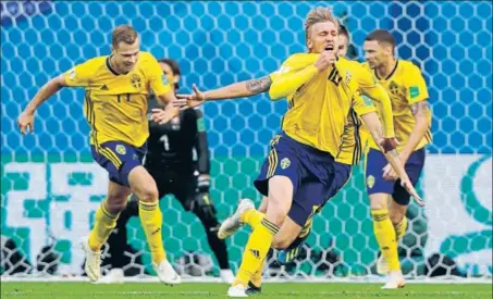  ?? AP ?? ■ Sweden's Emil Forsberg (centre) celebrates after scoring against Switzerlan­d in their Round of 16 match at St Petersburg on Tuesday.