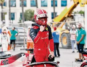  ?? Hamad Mohammed/Associated Press ?? Ferrari driver Charles Leclerc of Monaco exits his Formula car after earning the pole position Saturday for Sunday’s Azerbaijan Grand Prix.