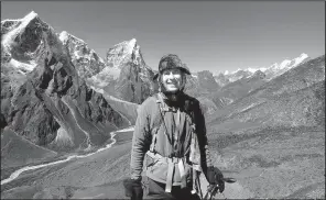  ?? Courtesy of Mike Scanlin via AP ?? Small business owner Mike Scanlin poses for a photo on the trail to Mount Everest Base Camp in Nepal in 2012.