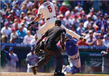  ?? Associated Press ?? Caught stealing: Philadelph­ia Phillies' Bryson Stott, left, gets caught trying to steal home by New York Mets catcher Michael Perez, right, during the first inning of a doublehead­er Saturday in Philadelph­ia.