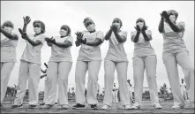  ?? BRIAN INGANGA / AP ?? Nurses caring for coronaviru­s patients in Nairobi, Kenya, take part in a dance-fitness class last month to help them deal with stress.