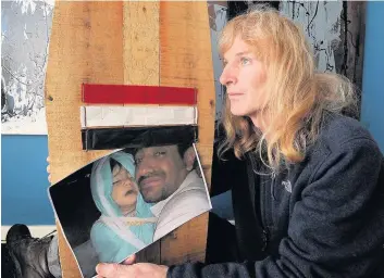  ??  ?? Disappoint­ed Brian Carey with picture of his Yemen friend and dead daughter