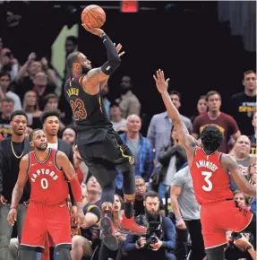  ?? DAVID MAXWELL/EPA-EFE ?? Cleveland’s LeBron James hit another buzzer-beater, an off-balance shot to beat Toronto on Saturday.