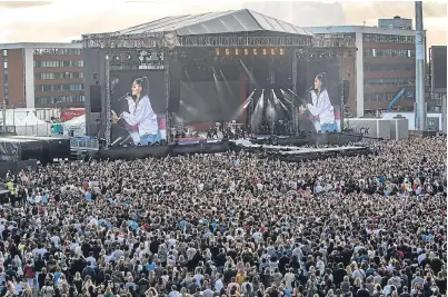  ?? Pictures: PA. ?? Ariana Grande performs during the One Love Manchester benefit concert at the Emirates Old Trafford where she was joined by a host of internatio­nal music stars including, right from top, Robbie Williams, Miley Cyrus and Katy Perry.