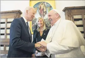  ?? VATICAN MEDIA VIA AP ?? US President Joe Biden, left, shakes hands with Pope Francis as they meet at the Vatican, Friday. President Joe Biden is set to meet with Pope Francis on Friday at the Vatican, where the world’s two most notable Roman Catholics plan to discuss the COVID-19 pandemic, climate change and poverty. The president takes pride in his Catholic faith, using it as moral guidepost to shape many of his social and economic policies.