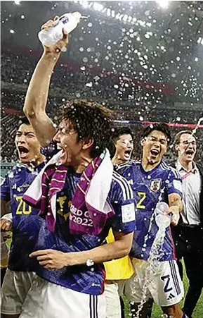  ?? Photo: ?? Japan players celebrate their 2-1 win against Spain. They finished as Group E winners after comeback wins over Germany and Spain. FIFA