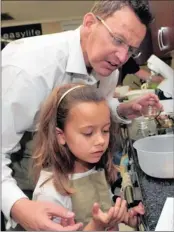  ?? PICTURES: BOXER NGWENYA ?? Johan and Allegra Bierman of Northcliff take part in a father-and-daughter cooking session at The Star’s Angela Day Kitchen organised by a forum of dads at Roedean School.