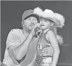  ?? SUBMITTED PHOTO ?? Lancaster resident Jemma Hill, 9, sings with country artist Luke Bryan Friday after he called her onstage during his concert on the Miller Family Farm near Baltimore.