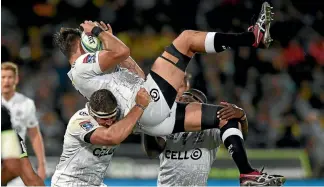  ?? PHOTO: GETTY IMAGES ?? Sharks lock Ruan Botha is hoping for a soft landing from his teammates after securing the ball during the Super Rugby match against the Hurricanes in Napier last night.