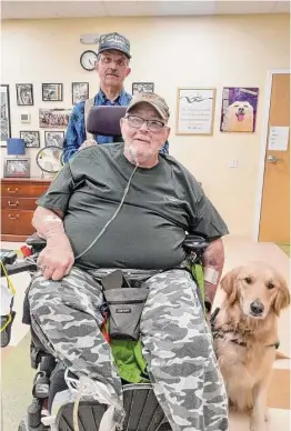  ?? Emily M. Olson / Hearst Connecticu­t Media ?? Winsted’s Educated Canines Assisting with Disabiliti­es held a graduation ceremony for six veterans this week, including Tom Williamson and his service dog, Peaches, and his partner, Bill Wescott.