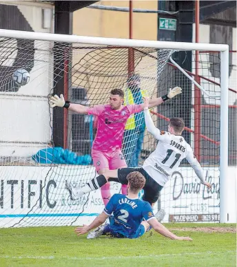  ??  ?? Dan Sparkes fires home Maidenhead's second against Chesterfie­ld. Darren Woolley.