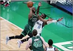  ?? CHARLES KRUPA - THE ASSOCIATED PRESS ?? FILE - Boston Celtics guard Kemba Walker (8) collides with Dallas Mavericks forward Tim Hardaway Jr. (11) on a drive to the basket during an NBA basketball game in Boston, in this Wednesday, March 31, 2021, file photo.