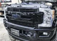  ??  ?? With the brackets assembled on the new cooler, it’s time to start the disassembl­y process on the truck. While Strictly Diesel offers a kit for the 2011-2016 Ford trucks, we’ll be installing their 2017-2019 version on this 2018 F250.