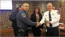  ?? PHOTO COURTESY OF UPPER PROVIDENCE TOWNSHIP ?? Newly promoted Cpl. John Oliveri takes the oath of office before Upper Providence Township Board of Supervisor­s’ Chairwoman Lisa Mossie and Police Chief Mark Toomey Tuesday night.