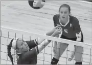  ?? Tommy Romanach / Rome News-Tribune ?? Coosa’s Brinley Smith hits the ball at the net as teammate Jordan Roberts (5) looks on during an Area 3-AA match against Chattooga on Tuesday at Coosa High School.