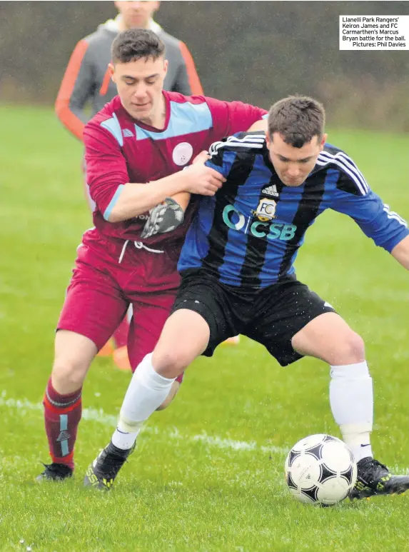  ??  ?? Llanelli Park Rangers’ Keiron James and FC Carmarthen’s Marcus Bryan battle for the ball.Pictures: Phil Davies