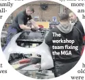  ??  ?? The workshop team fixing the MGA