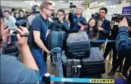  ?? THOMAS PETER / REUTERS ?? CNN’s Will Ripley transfers at Beijing Capital Internatio­nal Airport to board a plane to the DPRK on Tuesday.
