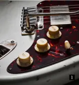  ??  ?? 1 The switching is clever and simple. The pushpush tone pot nearest the jack splits either bridge humbucker or neck P-90, while the middle pot selects middle pickup or the two outside units
