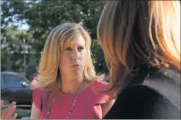  ?? Samie Gebers/The Signal ?? Christy Smith, left, a candidate for California’s 38th District Assembly, speaks to constituen­t and school board member Sue Solomon during an event in Newhall on Thursday.