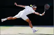  ??  ?? ROGER FEDERER RETURNS TO Tomas Berdych in their Men’s Singles semifinal match on day 11 at the Wimbledon Tennis Championsh­ips in London on Friday.