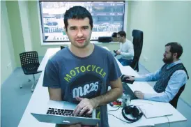  ??  ?? VORONEZH, Russia: In this photo taken on Thursday, Nov 24, 2016, software developer Ivan Grishaev and other programmer­s from Deep Refactorin­g work at their office. —AP
Mail.Ru’s history