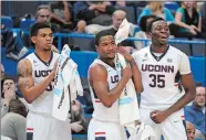  ?? FRED BECKHAM/AP PHOTO ?? UConn’s, from left, Shonn Miller, Rodney Purvis and Amida Brimah react during the second half of their exhibition game against New Haven on Saturday.
