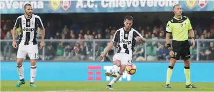  ?? — AP ?? VERONA: Miralem Pjanic scores during the Serie A soccer match between Chievo Verona and Juventus at the Bentegodi stadium in Verona, Italy, Sunday.