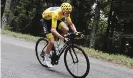  ?? —AP ?? CHAMBERY: Britain’s Chris Froome, wearing the overall leader’s yellow jersey, speeds downhill during the ninth stage of the Tour de France cycling race over 181.5 kilometers (112.8 miles) with start in Nantua and finish in Chambery, France, yesterday.