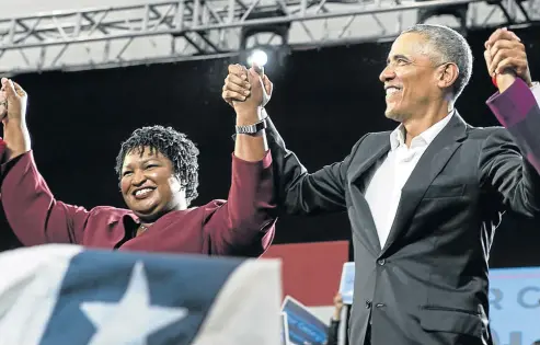  ?? Picture: GETTY IMAGES/AFP/JESSICA MCGOWAN ?? BATTLE LINES DRAWN: Former US president Barack Obama, right, stands with Georgia Democratic gubernator­ial candidate Stacey Abrams during a campaign rally at Morehouse College on Friday in Atlanta, Georgia. Obama spoke in Atlanta to endorse Abrams and encourage Georgians to vote.