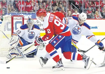  ??  ?? Oilers goalie Cam Talbot makes a save from Capitals centre Evgeny Kuznetsov.