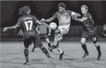  ?? CHANT PHOTOGRAPH­Y • CONTRIBUTE­D ?? HFX Wanderers FCS Andre Rampersad, middle, signed a two-year deal with the Canadian Premier League team.