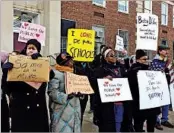  ?? MARIA DANILOVA/AP ?? Protesters gather Friday at Jefferson Middle School in Washington for Secretary of Education Betsy DeVos’ visit.