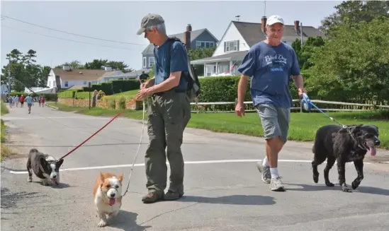  ?? CHRIS CHRISTO PHOTOS / HERALD STAFF ?? ALL TOO FAMILIAR: Walking their dogs Friday near the Kennedy compound in Hyannispor­t are Richard Bellamy, left, and Ben Ayres, who said Saoirse Kennedy Hill’s death is ‘a continuati­on of a history of tragedy.’ Kennedy neighbor Lauren Rolfe, top, outside the JFK Museum in Hyannis on Friday.