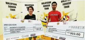  ??  ?? All smiles: Mohd Syafiq Kamal (right) and Hong Kong’s Tong Tsz Wing posing with their mock cheques after clinching the Malaysian Tour Squash Circuit No. 3 titles at the NSC Squash Centre in Jalan Duta yesterday. — NORAFIFI EHSAN/ The Star