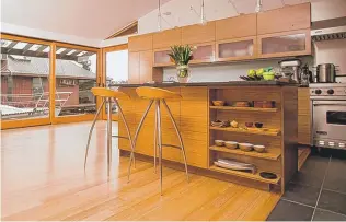  ?? | CREATORS PHOTO COURTESY OF “KENNEDY GREEN HOUSE.” ?? Eco-savvy flooring: Sustainabl­e bamboo helps make a contempora­ry kitchen easy on the eyes — and the breathing.