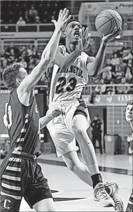  ?? [JOHN HULKENBERG/THISWEEK NEWSPAPERS] ?? Wellington’s Noah Berry, who finished with 10 points, goes to the basket against Portsmouth Clay.