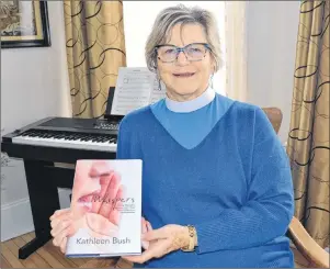  ?? ERIC MCCARTHY/JOURNAL PIONEER ?? Ann Bush displays a copy of her recently published book, “Whispers”. The Anglican priest said it is her hope that her life story will help inspire others on their faith journey. The official launch for the book is this evening at the Summerside Library.