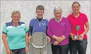  ??  ?? Lindsay Garrett, Ailie MacBrayne and Mairi MacMillan with their silverware, presented by ladies’ captain Jana Macpherson, second from the right.