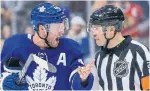  ?? RICK MADONIK TORONTO STAR ?? Leafs Morgan Rielly debates with referee Graham Skilliter after the net came off its moorings in the third period.