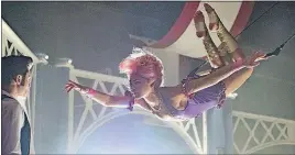  ?? [20TH CENTURY FOX] ?? Zendaya and Zac Efron in a highflying scene from “The Greatest Showman.” A: